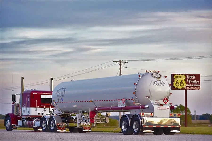 Farmers Oil truck and propane transport beside the Route 66 Truck and Trailer sign