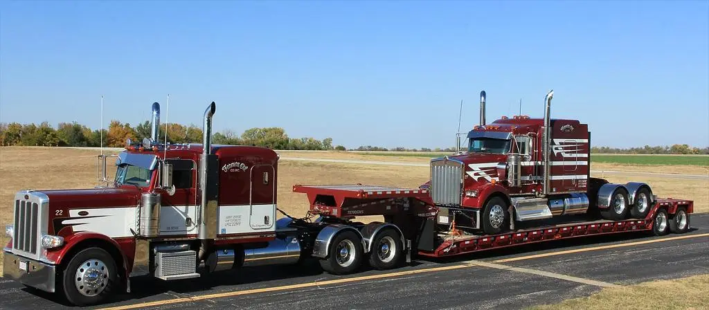 Farmers Oil Peterbilt with a detachable gooseneck lowboy trailer