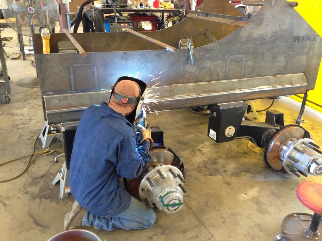 A technician welding a trailer frame in the Route 66 Truck & Trailer shop in Afton, Oklahoma
