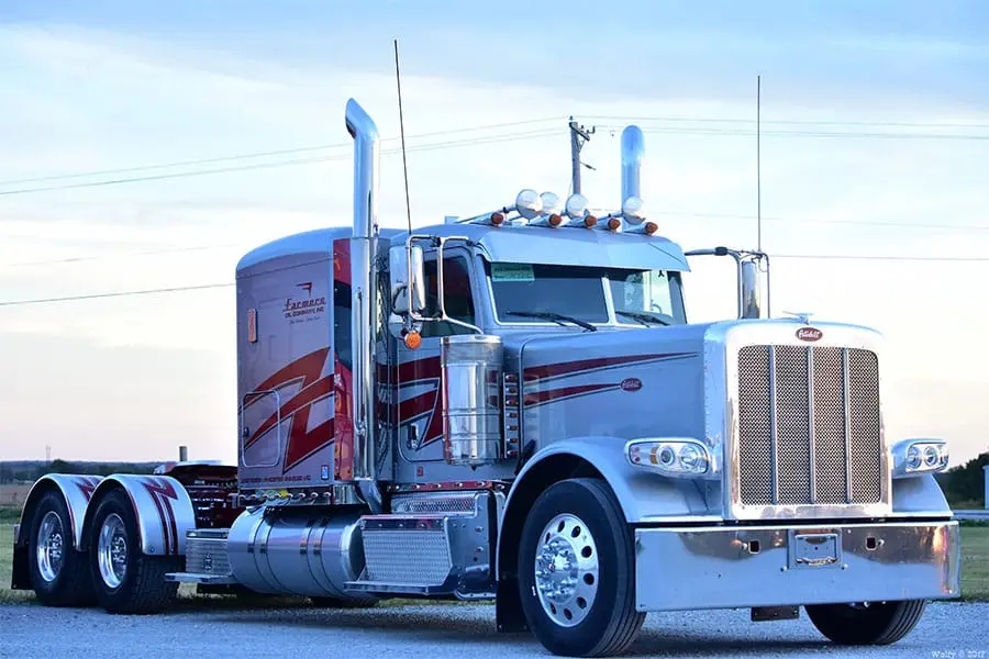 Silver Farmers Oil Peterbilt with maroon stripes