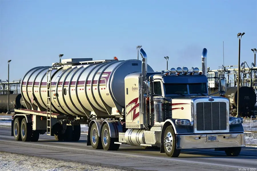 Farmers Oil Peterbilt pulling a polished stainless liquid fertilizer tanker